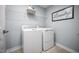 Laundry room featuring a washer, dryer and wire shelving at 70 Saintsbury Dr, Fuquay Varina, NC 27526