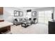 A well decorated living room area with neutral paint, carpet and modern furnishings at 70 Saintsbury Dr, Fuquay Varina, NC 27526