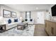 Cozy living room featuring modern decor, hardwood flooring and an abundance of natural light at 70 Saintsbury Dr, Fuquay Varina, NC 27526