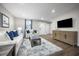Comfortable living room featuring modern decor and hardwood flooring throughout at 70 Saintsbury Dr, Fuquay Varina, NC 27526