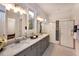 Modern bathroom with double vanity, sleek countertops, contemporary lighting, and a glass-enclosed shower at Tbd Hudson Hills Rd, Pittsboro, NC 27312