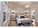 Serene bedroom featuring neutral decor, hardwood floors, ample natural light, and a view of ensuite bathroom at Tbd Hudson Hills Rd, Pittsboro, NC 27312
