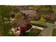 Breathtaking aerial view of a lakeside community with lush landscaping and upscale homes at sunset at 1004 Dunleigh Dr, Burlington, NC 27215