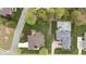 Aerial view of a home with a swimming pool and mature trees at 1004 Dunleigh Dr, Burlington, NC 27215