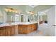 Bathroom featuring double vanity, great lighting and an open view to the primary bedroom at 1004 Dunleigh Dr, Burlington, NC 27215