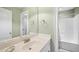 A neutral-toned bathroom features a single vanity and shower/tub combination at 1004 Dunleigh Dr, Burlington, NC 27215