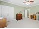 Spacious bedroom featuring a desk, closet, and a view to the hallway at 1004 Dunleigh Dr, Burlington, NC 27215