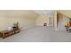 A large bonus room features neutral carpet and access to a staircase at 1004 Dunleigh Dr, Burlington, NC 27215