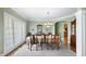 Elegant dining room with large windows, hardwood floors, and traditional decor at 1004 Dunleigh Dr, Burlington, NC 27215