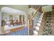 Spacious foyer with hardwood floors, staircase, and open layout to the dining room at 1004 Dunleigh Dr, Burlington, NC 27215