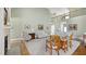 Open-concept living room with high ceilings, fireplace, and comfortable furnishings at 1004 Dunleigh Dr, Burlington, NC 27215