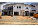 New townhomes under construction with Tyvek HomeWrap for weather protection and future curb appeal at 1047 Winding Spring Dr, Mebane, NC 27302