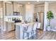 Stylish kitchen featuring stainless steel appliances, a kitchen island with white countertop and modern cabinets at 1047 Winding Spring Dr, Mebane, NC 27302