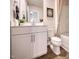 Well-lit bathroom featuring a modern vanity, a neutral color palette, and a shower-tub combo at 1049 Winding Spring Dr, Mebane, NC 27302