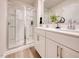 Modern bathroom with a glass-enclosed shower, double vanity, and elegant fixtures. Ready to move in at 1049 Winding Spring Dr, Mebane, NC 27302