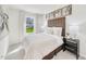 Bright bedroom with a large window, soft carpet, and a neutral color palette at 1049 Winding Spring Dr, Mebane, NC 27302