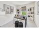 Stylish home office with a sleek desk, comfortable seating, and shelving, perfect for working from home at 1049 Winding Spring Dr, Mebane, NC 27302