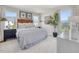Modern bedroom features two windows, stylish bed and linen with a bedside table and decor at 1051 Winding Spring Dr, Mebane, NC 27302