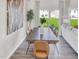 Dining room with a large table, modern chairs, hardwood floors, and natural light from sliding glass doors at 1051 Winding Spring Dr, Mebane, NC 27302