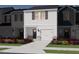 Newly built townhome with a front lawn and landscaping that adds to the curb appeal at 1051 Winding Spring Dr, Mebane, NC 27302