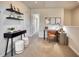 Upstairs office space features a black desk, shelving and a natural light and neutral decor at 1051 Winding Spring Dr, Mebane, NC 27302