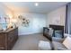 Bedroom showcases neutral tones, a crib, a dresser, and unique decorative shelves at 1053 Winding Spring Dr, Mebane, NC 27302