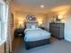 Bedroom with soft blue decor, plush carpeting, and a cozy, inviting atmosphere at 1053 Winding Spring Dr, Mebane, NC 27302