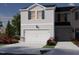 Charming two-story home featuring a two-car garage and beautiful light gray siding at 1053 Winding Spring Dr, Mebane, NC 27302