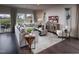 Comfortable living room area with hardwood floors, stylish furniture, decor, and plenty of sunlight at 1053 Winding Spring Dr, Mebane, NC 27302