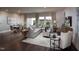 Spacious living room featuring hardwood floors, stylish furniture, decor, and ample natural light at 1053 Winding Spring Dr, Mebane, NC 27302