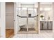 Luxurious tiled shower featuring a built-in seat and glass door enclosure at 1085 Fairhaven Dr # 49, Mebane, NC 27302