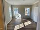 Bright bedroom with luxury vinyl plank flooring and natural light at 1085 Fairhaven Dr # 49, Mebane, NC 27302