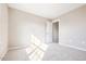This bedroom features neutral colored walls, plush carpet, and a door to a closet at 1085 Fairhaven Dr # 49, Mebane, NC 27302