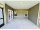 View of back patio showing the double french doors and view into the kitchen at 1085 Fairhaven Dr # 49, Mebane, NC 27302