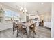 Eat-in kitchen and dining area with natural light, neutral colors and wood furnishings at 1085 Fairhaven Dr # 49, Mebane, NC 27302