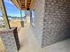 Close-up of the exterior brick facade of a new home under construction, including a framed window at 1085 Fairhaven Dr # 49, Mebane, NC 27302