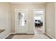 Welcoming foyer features a glass paneled door and an open view to a home office at 1085 Fairhaven Dr # 49, Mebane, NC 27302