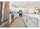 Bright kitchen featuring stainless steel appliances, white cabinets, and subway tile backsplash at 1085 Fairhaven Dr # 49, Mebane, NC 27302