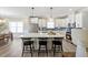 Spacious kitchen features white cabinets, stainless steel appliances, and a large center island at 1085 Fairhaven Dr # 49, Mebane, NC 27302