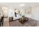 Bright living room featuring hardwood floors, neutral paint, large windows, and modern furniture at 1085 Fairhaven Dr # 49, Mebane, NC 27302