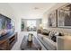 Comfortable living room with contemporary decor, TV, and large windows for light at 1085 Fairhaven Dr # 49, Mebane, NC 27302
