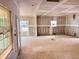 Spacious unfinished living room area; bright with natural light at 1085 Fairhaven Dr # 49, Mebane, NC 27302