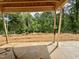 Unfinished patio area overlooking a wooded backyard, ready for customization at 1085 Fairhaven Dr # 49, Mebane, NC 27302