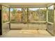 Inviting screened porch showing a view of the fall foliage at 1085 Fairhaven Dr # 49, Mebane, NC 27302