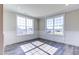 Bright, sunny room featuring lots of windows, neutral colors, and LVP flooring at 1085 Fairhaven Dr # 49, Mebane, NC 27302