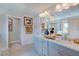 Bathroom featuring double sink vanity, framed mirror, and tile flooring at 1125 Sun Springs Rd, Wake Forest, NC 27587