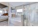 Bathroom showcases a glass-enclosed shower and soaking tub with window views at 1125 Sun Springs Rd, Wake Forest, NC 27587