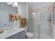 Bathroom featuring a sleek vanity, modern fixtures, and a glass-enclosed shower with stylish tile at 1125 Sun Springs Rd, Wake Forest, NC 27587