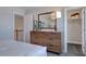 Bedroom with dresser, mirror, and access to the walk-in closet at 1125 Sun Springs Rd, Wake Forest, NC 27587