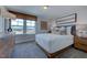 Bedroom with neutral decor, large window, wood trim, and plenty of natural light at 1125 Sun Springs Rd, Wake Forest, NC 27587